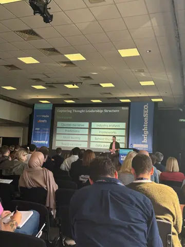 Christian Rigg, Best of Both Worlds: AI Content Systems with True Human EEAT — brightonSEO 2026, zdjęcie 1 (12:07)